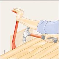 Illustration of a man's hand, nailing and inserting a final strip with a pry bar.