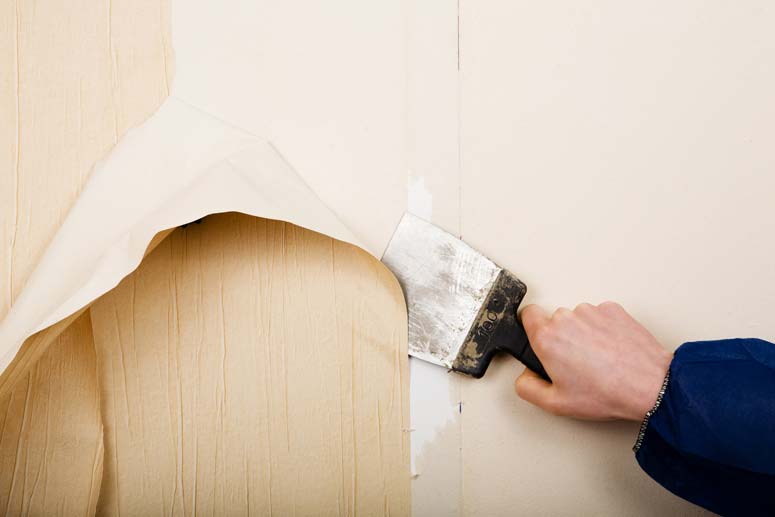 removing wallpaper with flat scraper