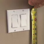 light switch and measuring tape with center of switch at 48-inch mark