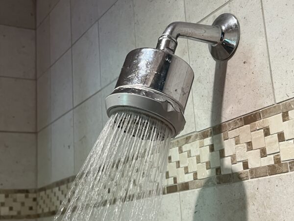 Replace the shower head and test the flow. 