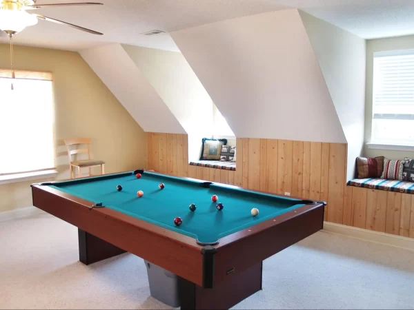 View of a recreation room designed in attic space