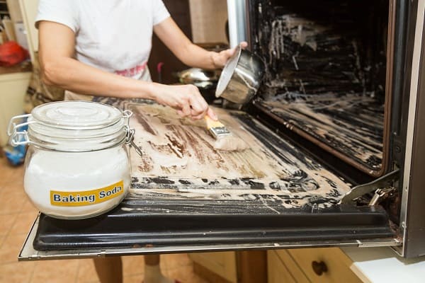 Oven cleaning with baking soda paste