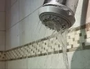 When a shower head loses the power behind its spray, the cause is usually mineral buildup.