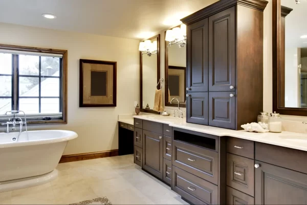 View of bathroom cabinets with metal knobs and handles