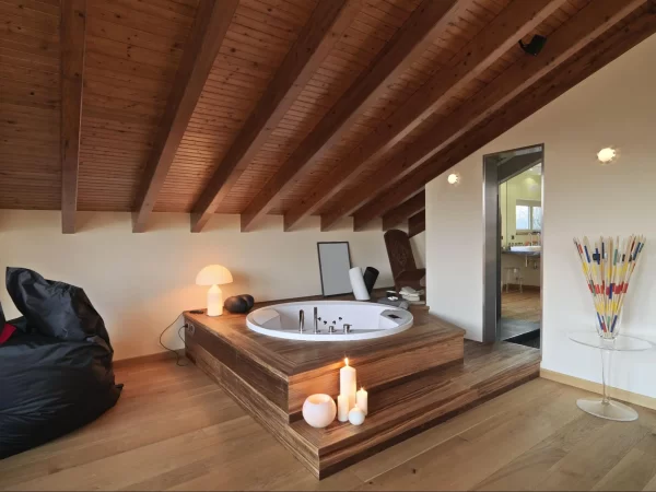 View of an attic space with built-in Jacuzzi tub