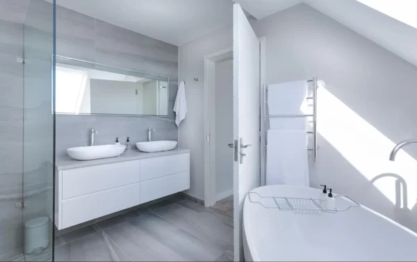 View of an all-white bathroom in attic space