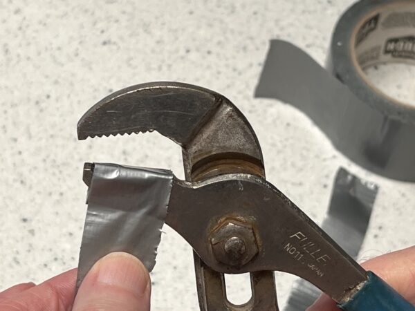 wrap the jagged jaws of pliers with duct tape to protect the finish on plumbing