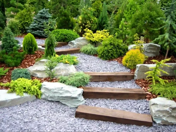 This dramatic, elevated pathway features large steps from landscaping timbers and contrasting textures of gravel.