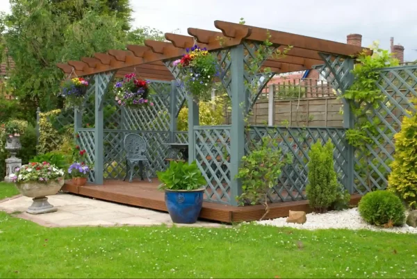 Lattice panels and a pergola create a sense of privacy and intimacy in this charming backyard retreat.