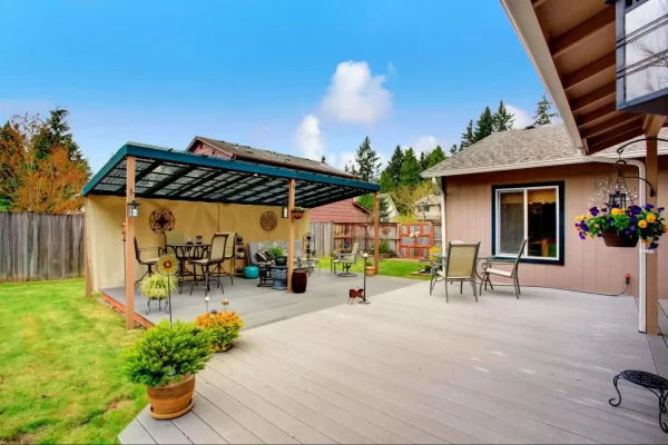 A covered patio extends the living space into the backyard, blurring the lines between indoor and outdoor living.