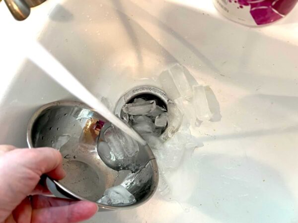 pouring ice into garbage disposal