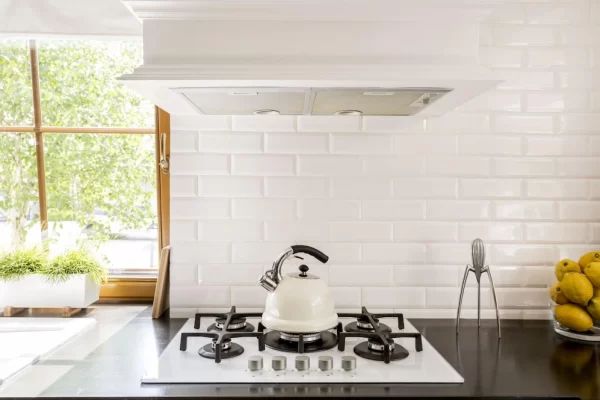 Simple lines and white surfaces give this kitchen a clean, tranquil aesthetic. 