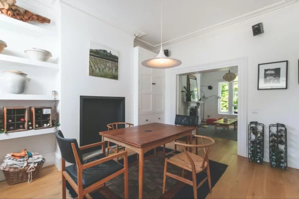 Scandinavian-style dining table and chairs provide mid-century design elements in this simple dining space