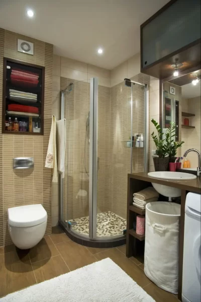 A compact corner shower and smart storage solutions make this small bathroom a cozy haven.