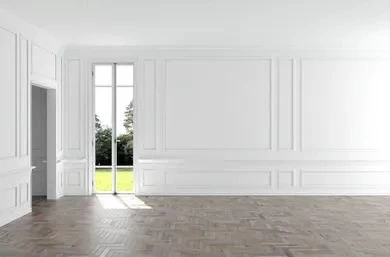 Though not one of Gaines’s designs, this image illustrates how plain white walls are elevated with trim that adds dimension