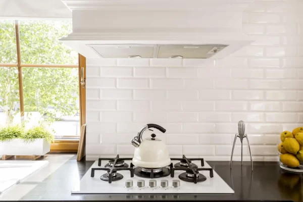 Simple white subway tiles in backsplash give this kitchen a bright, tranquil look.