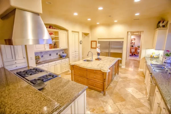 Vintage appeal and unique craftsmanship at the edges of this kitchen island elevate the beauty of this kitchen.