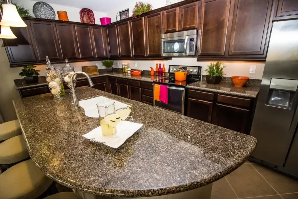 The unique curvy shape of this kitchen island adds personality and interest to this kitchen. 