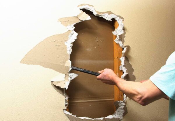 sheetrock wall being demolished