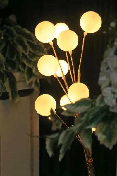 Whimsical floor lamp, with its luminous orbs and graceful branches, adds a touch of artistry and magic to any space.