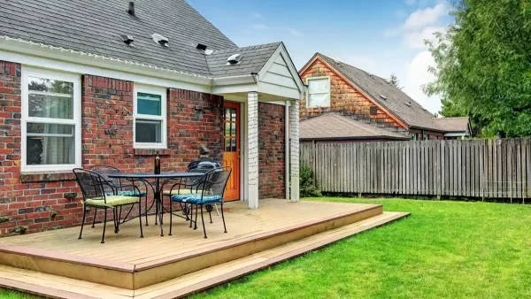 This small deck space has been turned into a comfortable seating area that enhances functionality of this outdoor area.