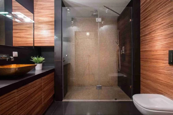 Intricate mosaic tiles in the shower area elevate the look of this bathroom. 