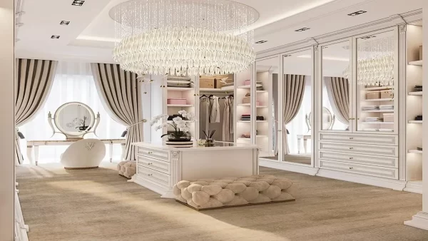 With muted tones, tufted furniture, and a massive chandelier this walk-in closet screams luxury. 