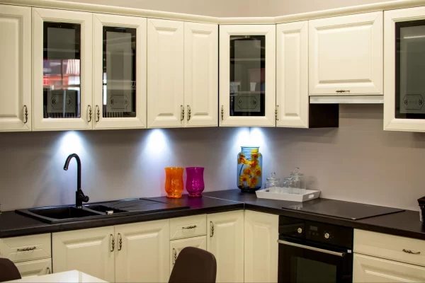 Glass doors are the perfect partner for these white cabinets, adding visual interest. 