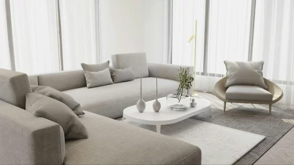 The soft tones of the sectional sofa contribute to the overall serenity of this white-dominated living room. 