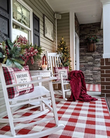 Cozy Christmas Porch: Rocking Chairs, Checkered Rug, and Festive Touches