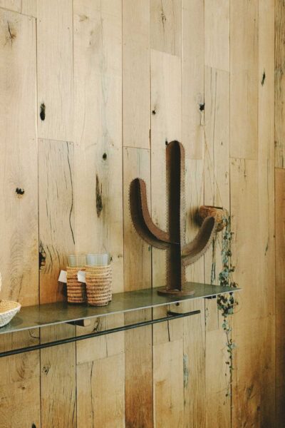 Tongue-and-groove wood board paneling with a shelf on the wall