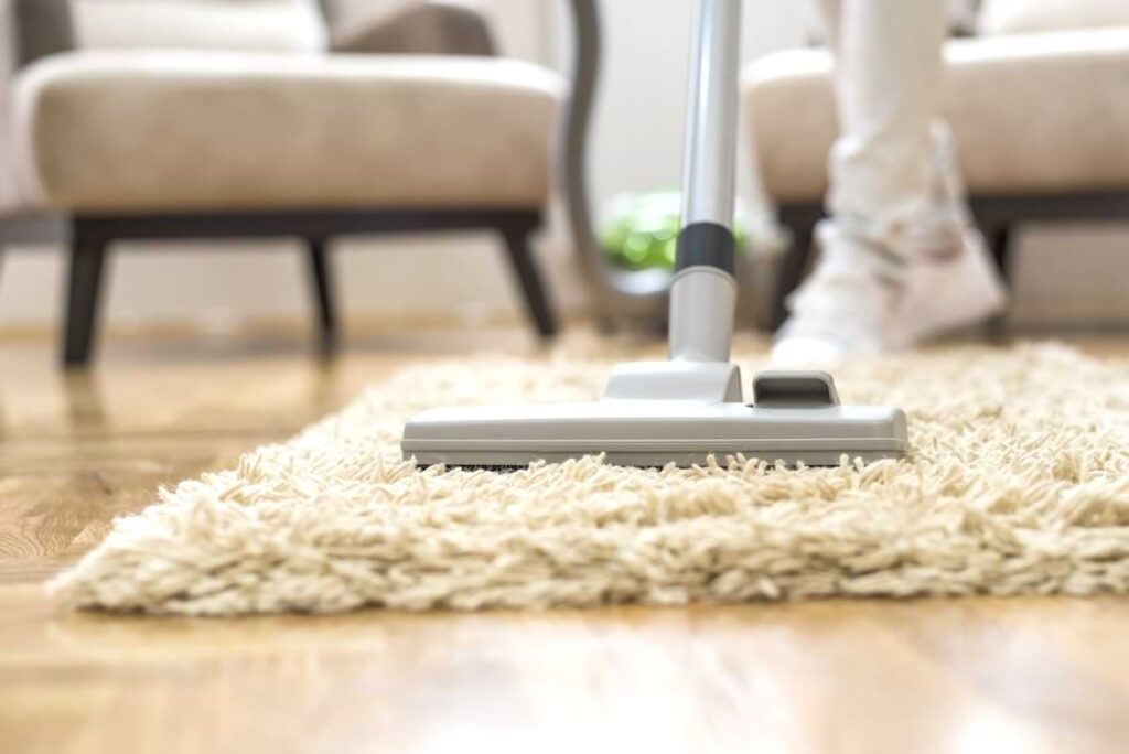 vacuuming carpet